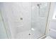Large walk-in shower with marble tile and a rain shower head at 916 Ardmore Dr, Durham, NC 27713