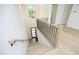 Modern staircase with light wood treads and black metal railing at 916 Ardmore Dr, Durham, NC 27713