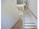 Elegant staircase with light wood and black metal accents at 916 Ardmore Dr, Durham, NC 27713