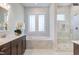Spa-like bathroom with soaking tub, walk-in shower, and double vanity at 1 Kelsey Ct, Hillsborough, NC 27278