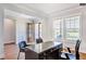 Bright home office features hardwood floors, built-in desk, and large windows at 1 Kelsey Ct, Hillsborough, NC 27278