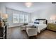Spacious main bedroom with hardwood floors and ample natural light at 1 Kelsey Ct, Hillsborough, NC 27278