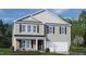 Two-story house with gray siding, stone accents, and a two-car garage at 111 Reagan Crest Dr, Clayton, NC 27520