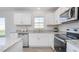 Modern kitchen with white cabinets and granite countertops at 111 Reagan Crest Dr, Clayton, NC 27520