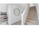 Modern staircase with carpet runner and light-filled entryway at 111 Reagan Crest Dr, Clayton, NC 27520