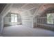 An attic bedroom featuring 2 windows at 1117 Delilia Ln, Wake Forest, NC 27587