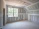 A bedroom with a high ceiling and a large window at 1117 Delilia Ln, Wake Forest, NC 27587