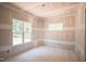 Well-lit room with two windows offering pleasant views of the outdoors at 1117 Delilia Ln, Wake Forest, NC 27587