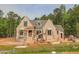 An attractive one-story brick house is under construction with scaffolding at 1117 Delilia Ln, Wake Forest, NC 27587