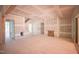 Spacious, unfinished living room with sliding doors, abundant light, and raw timber accents, ready for personalization at 1117 Delilia Ln, Wake Forest, NC 27587