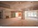Spacious living area with sliding glass doors, fireplace, and drywalled walls, presenting a blank canvas for customization at 1117 Delilia Ln, Wake Forest, NC 27587