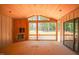 Screened sunroom featuring a wooden ceiling, fireplace, and expansive views at 1117 Delilia Ln, Wake Forest, NC 27587