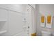 Clean bathroom with a shower/tub combo and built-in shelving at 115 Reagan Crest Dr, Clayton, NC 27520