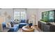 Comfortable living room featuring sectional sofa and large TV at 115 Reagan Crest Dr, Clayton, NC 27520