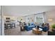 Open concept living room with kitchen and dining area views at 115 Reagan Crest Dr, Clayton, NC 27520