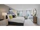 Spacious main bedroom with a king-size bed and large windows at 115 Reagan Crest Dr, Clayton, NC 27520