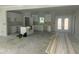 Spacious kitchen featuring white cabinets and an island awaiting countertops and appliances at 132 Black Cloud Dr, Louisburg, NC 27549