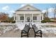 Community center with benches in front, snow on the ground at 204 Ribbon Walk Ln, Holly Springs, NC 27540