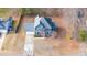 Two-story house aerial view, gray siding, red door, driveway, and yard at 300 Ashwick Dr, Efland, NC 27243