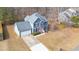 Two-story house, gray siding, red door, attached garage, and yard at 300 Ashwick Dr, Efland, NC 27243
