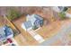 Aerial view of a two-story house with gray siding and a red door at 300 Ashwick Dr, Efland, NC 27243