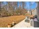 Spacious backyard with patio and wooded area at 300 Ashwick Dr, Efland, NC 27243