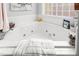 Relaxing bathroom with a large corner jacuzzi tub at 300 Ashwick Dr, Efland, NC 27243