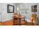 Bright breakfast nook features a wooden table and wicker chairs at 300 Ashwick Dr, Efland, NC 27243
