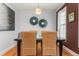 Dining room with dark wood table, woven chairs, and natural light at 300 Ashwick Dr, Efland, NC 27243