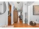 Bright entryway with hardwood floors, leading to living room and kitchen at 300 Ashwick Dr, Efland, NC 27243