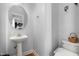 Small half bathroom with pedestal sink and toilet at 300 Ashwick Dr, Efland, NC 27243