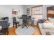 Home office features a desk, chair, and comfortable couch at 300 Ashwick Dr, Efland, NC 27243