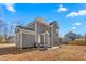 Gray house exterior with backyard patio at 300 Ashwick Dr, Efland, NC 27243