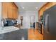 Modern kitchen with stainless steel appliances and wood cabinets at 300 Ashwick Dr, Efland, NC 27243