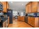 Modern kitchen with stainless steel appliances and wood cabinets at 300 Ashwick Dr, Efland, NC 27243