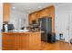 Modern kitchen with stainless steel appliances and wood cabinets at 300 Ashwick Dr, Efland, NC 27243