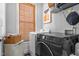 Laundry room with washer, dryer, and shelving at 300 Ashwick Dr, Efland, NC 27243