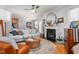 Living room with a fireplace, comfortable seating, and a view into the kitchen at 300 Ashwick Dr, Efland, NC 27243