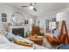 Living room featuring a fireplace, large mirror, and comfortable seating at 300 Ashwick Dr, Efland, NC 27243