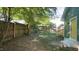 Fenced backyard with a deck and a tree at 300 Worth St, Raleigh, NC 27601