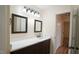 Updated bathroom with a double vanity, new flooring, and a shower/tub combo at 300 Worth St, Raleigh, NC 27601
