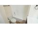 Clean bathroom with a bathtub, toilet and updated vanity at 300 Worth St, Raleigh, NC 27601