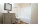 Clean bathroom with a single vanity, shower/tub, and updated fixtures at 300 Worth St, Raleigh, NC 27601