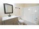 Clean bathroom with a single vanity, shower/tub, and updated fixtures at 300 Worth St, Raleigh, NC 27601