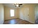 Bright bedroom with hardwood floors, ceiling fan and closet at 300 Worth St, Raleigh, NC 27601