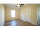 Spacious bedroom with hardwood floors, ceiling fan, and a closet at 300 Worth St, Raleigh, NC 27601