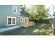 Green house exterior with a deck and fenced backyard at 300 Worth St, Raleigh, NC 27601