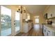 Open concept kitchen boasts stainless steel appliances and light wood floors at 300 Worth St, Raleigh, NC 27601