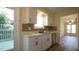 Updated kitchen with stainless steel appliances and white shaker cabinets at 300 Worth St, Raleigh, NC 27601