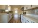 Modern kitchen with white cabinets, stainless steel appliances, and quartz countertops at 300 Worth St, Raleigh, NC 27601